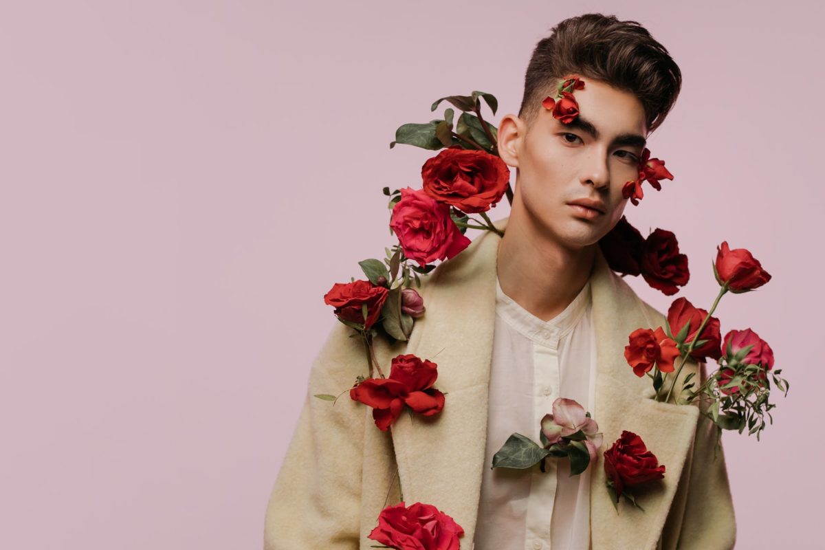 man with red roses