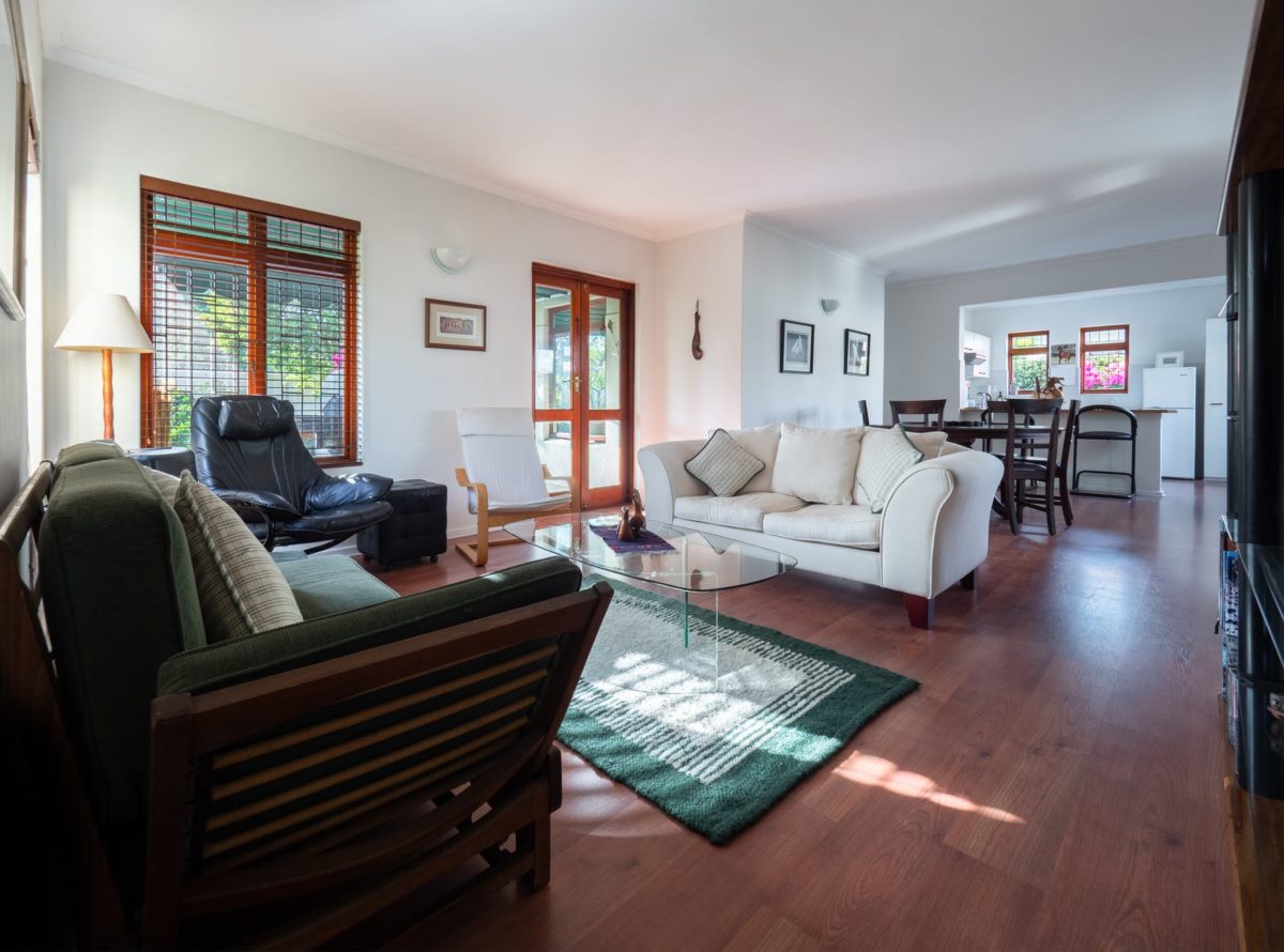 photo of white sofa near glass table